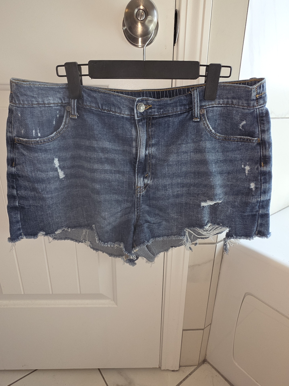 aerie medium blue denim shorts with gold contrast stitching